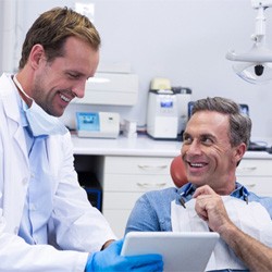 Man at dental implant consultation in Denver