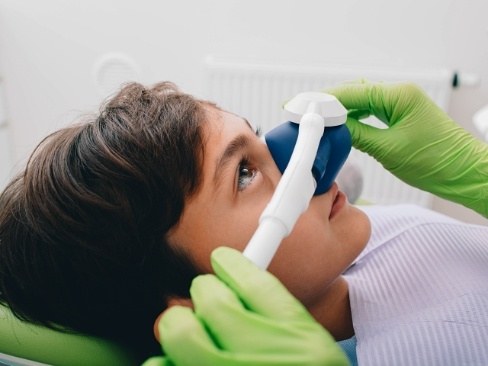 Boy with nitrous oxide dental sedation mask on