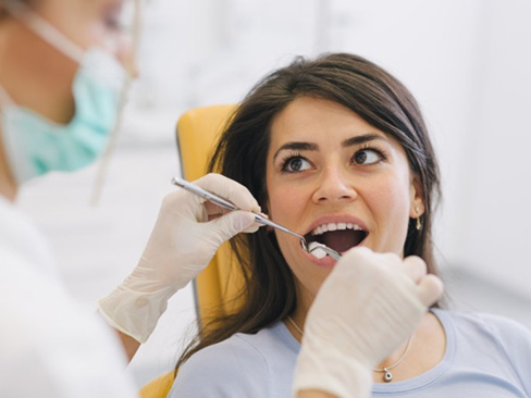 Female patient having her teeth checked 