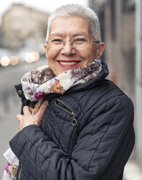 Woman smiling with dentures in Denver