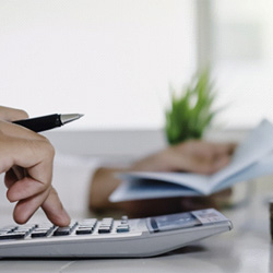 Man calculating cost of dentures in Denver