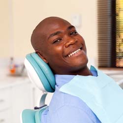 Patient smiling while visiting Denver emergency dentist