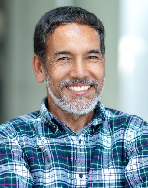 Man sharing healthy smile after visiting the dentist