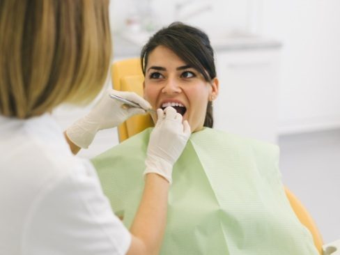 Woman receiving dental treatment