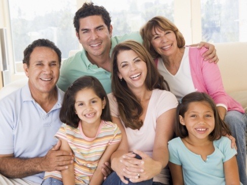 Three generations of famly smiling together