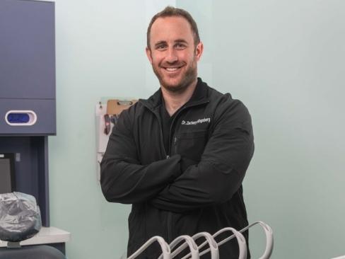 Denver dentist in dental office smiling