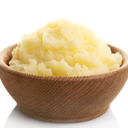 Close-up of wooden bowl of mashed potatoes