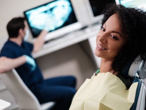 Woman laying back in dental exam chair