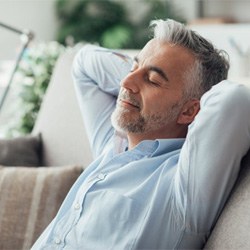 a man resting after receiving oral conscious sedation