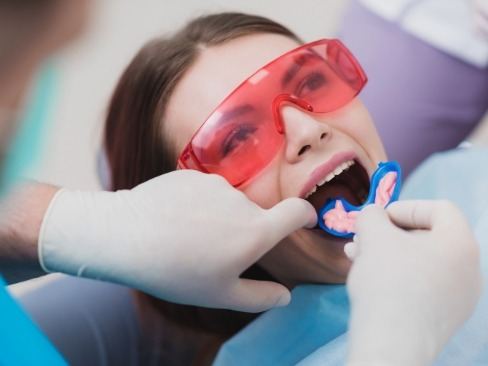 Young girl receiving fluoride treatment