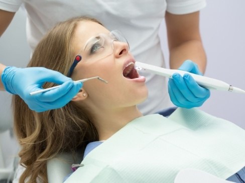 dentist using intraoral camera