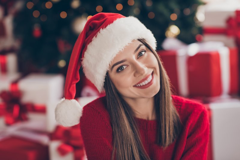 Smiling woman in a Santa hat