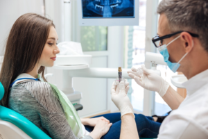 a patient during their dental implant consultation 