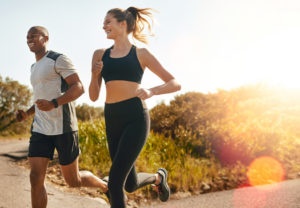 a pair of people exercising during the day